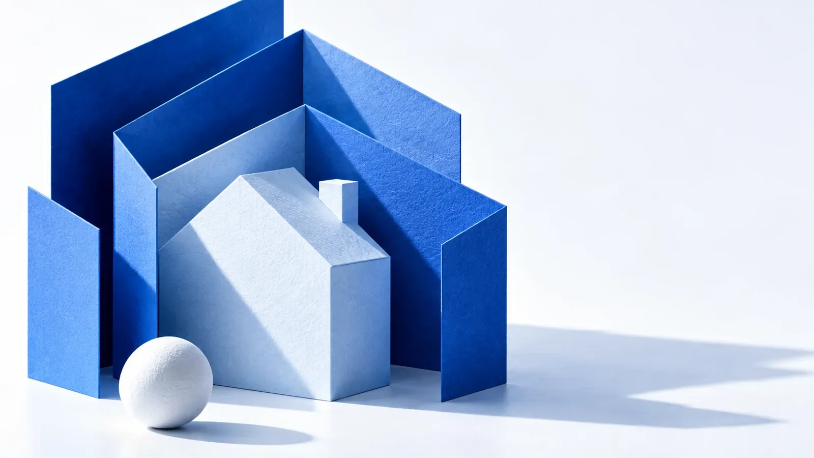 A blue paper house sheltered by layered protective paper walls.